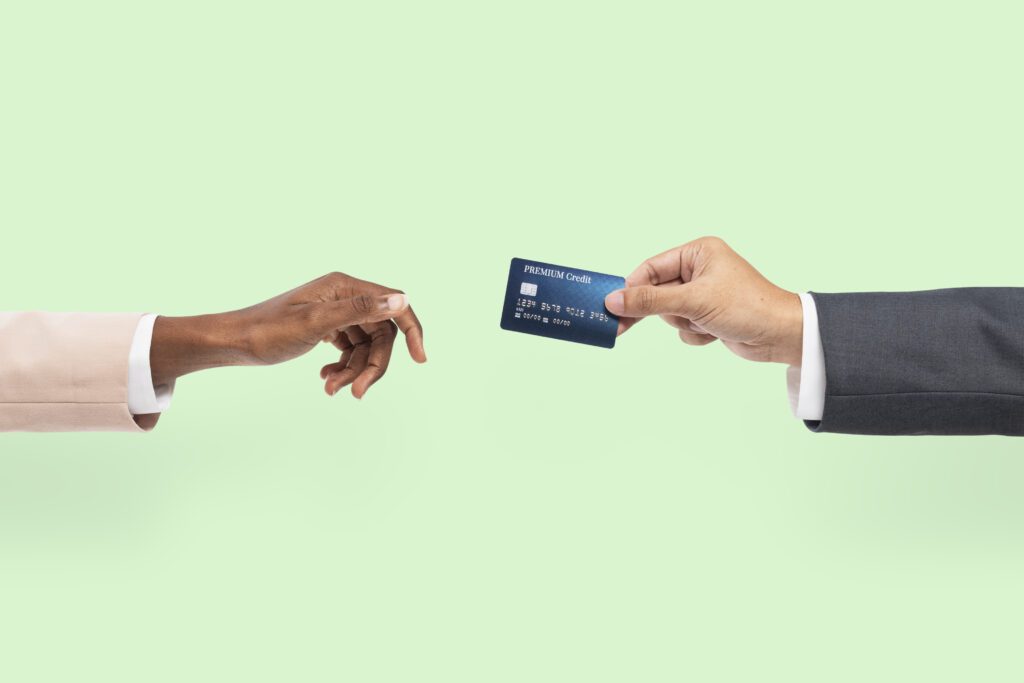 Credit card finance held by a hand for banking campaign