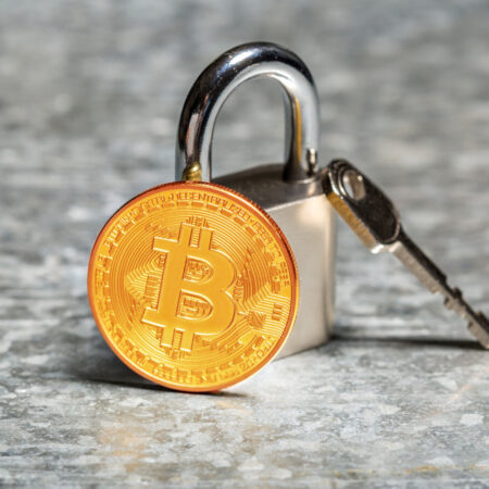 Padlock and key with Bitcoin representing KYC in crypto