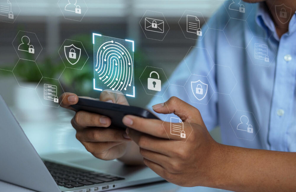 Hands holding a smartphone with digital lock and verification icons representing an age verification system